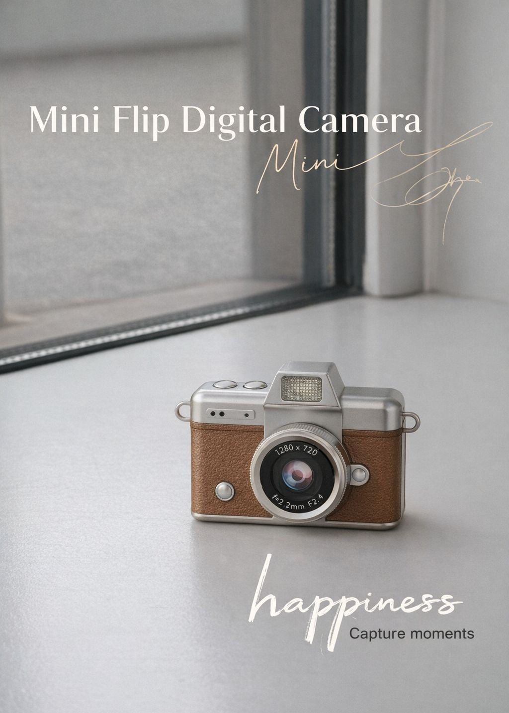 Vintage style brown mini flip digital camera held in hand