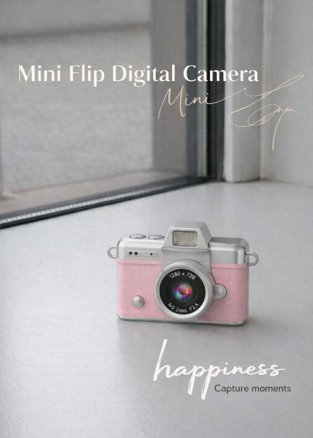 Vintage style pink mini flip digital camera held in hand