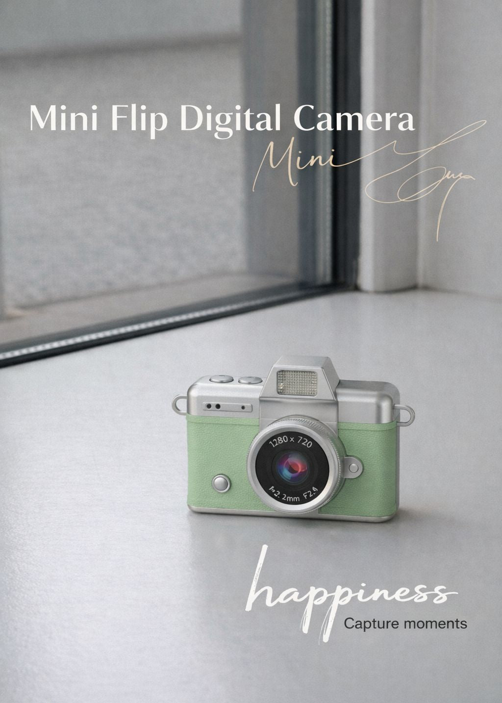 Vintage style green mini flip digital camera held in hand