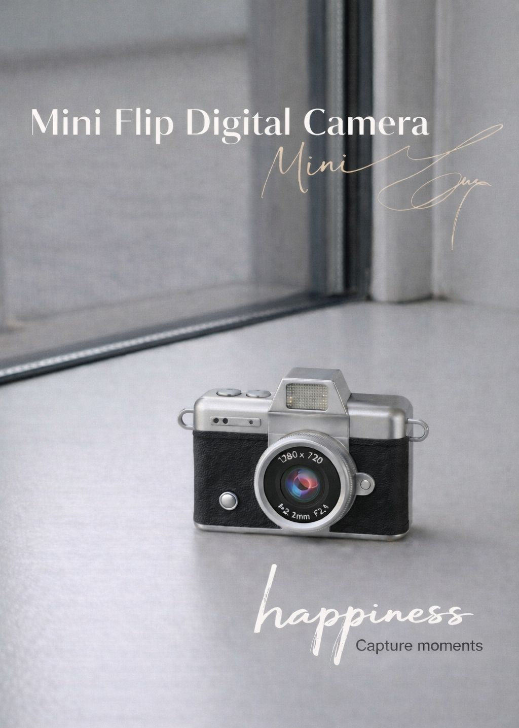 Vintage style black mini flip digital camera held in hand, portable travel gadget